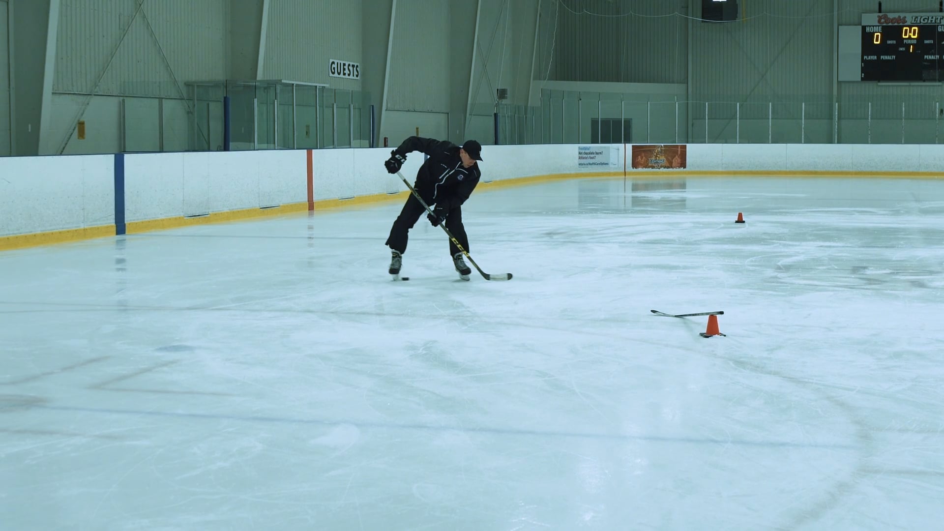 Putting Pucks Through Feet Drill